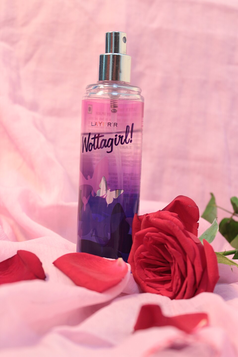 Perfume bottle and roses